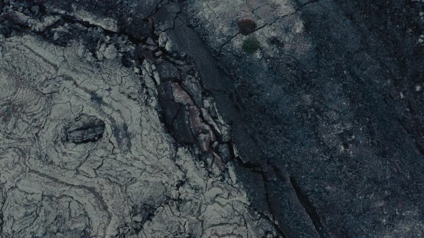 Aerial view of the colorful rock formations in a volcanic rocky field