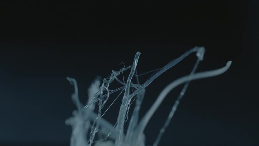 Melting strands of plastic