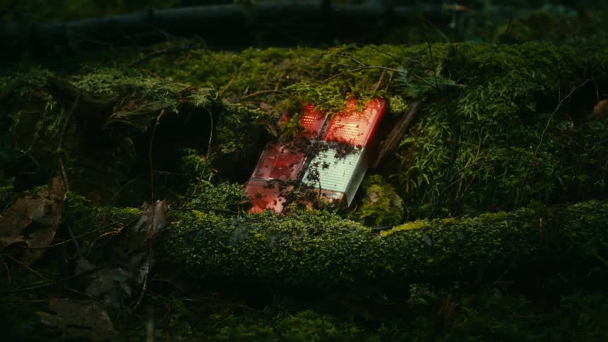 A partially buried light blinks