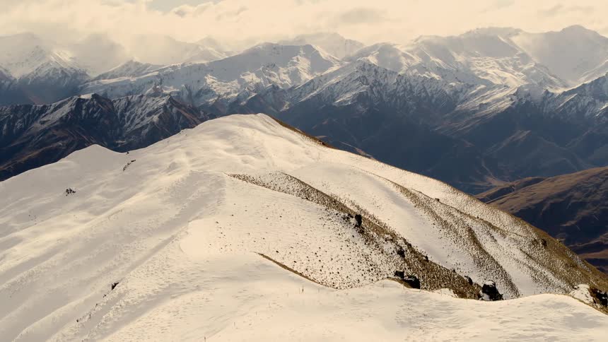 People are skiing on the mountain top