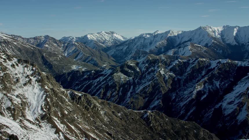 Large mountain ranges with a dusting of snow