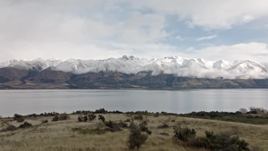 A lake is before the mountain range