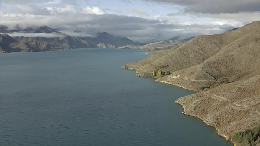 A large lake touches the mountains