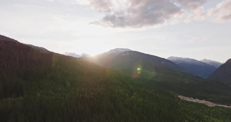 The sun is rising on the mountains