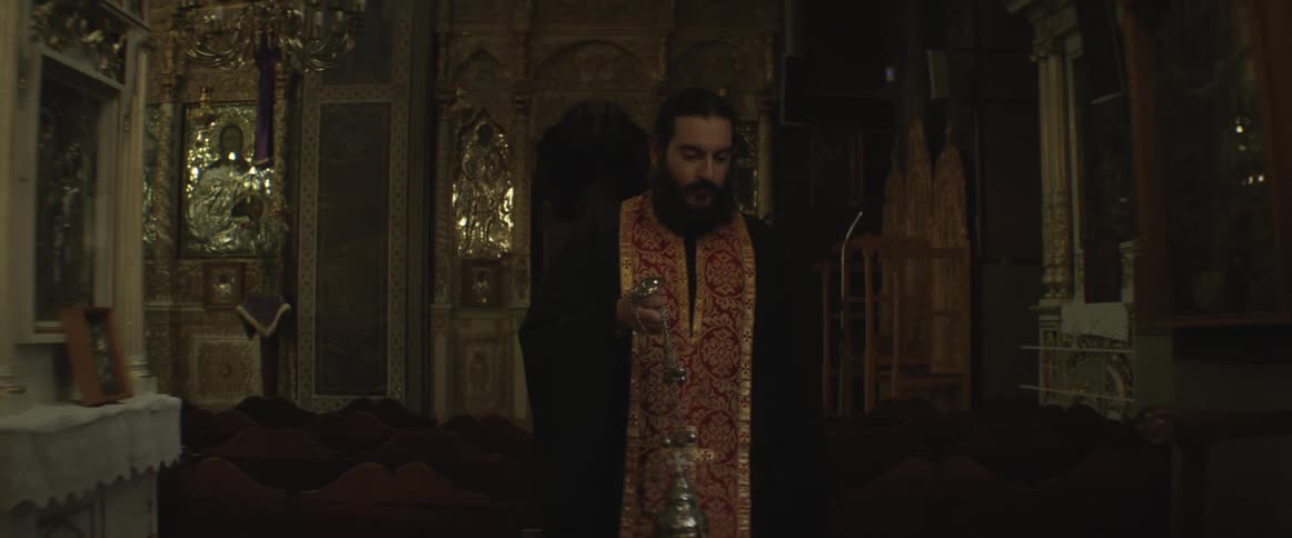 A religious man walks through a church