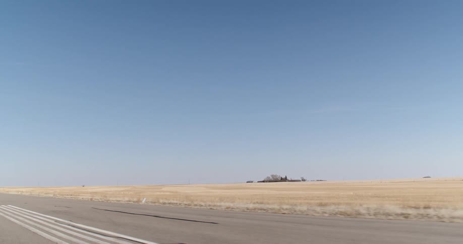 Gray audi moving on a paved road