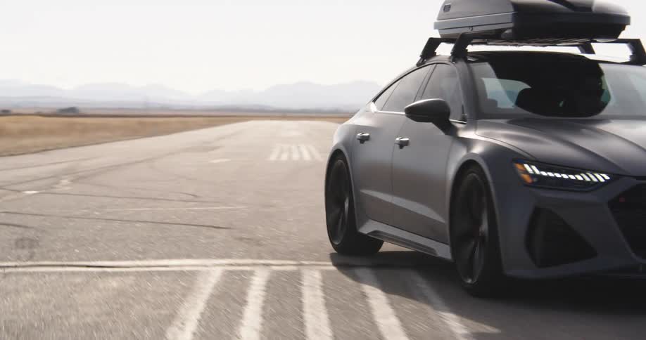 Gray sports car moving on a track