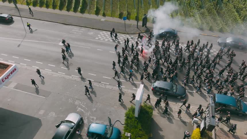 The marching protestors are lighting off flares