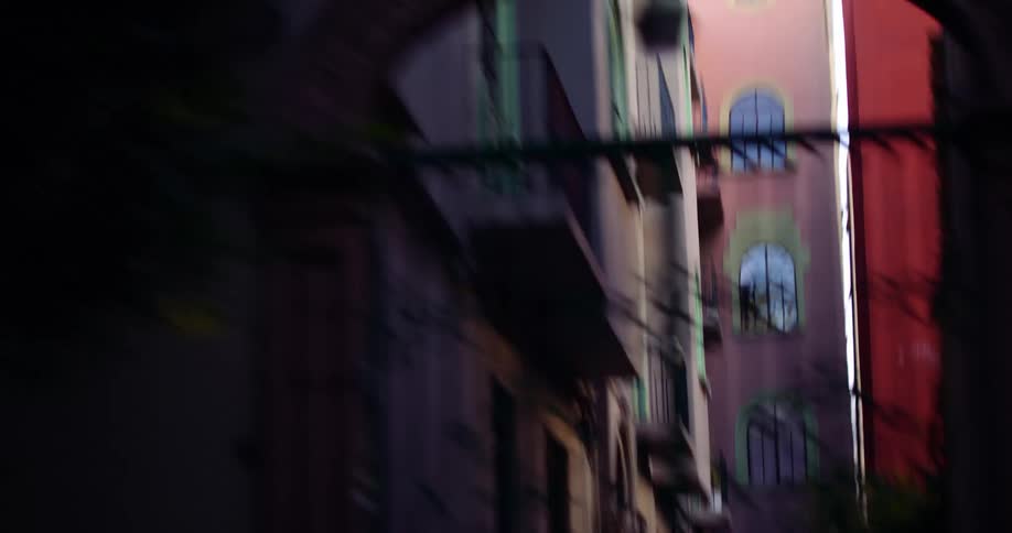 Colorful buildings in the city seen from a moving vehicle