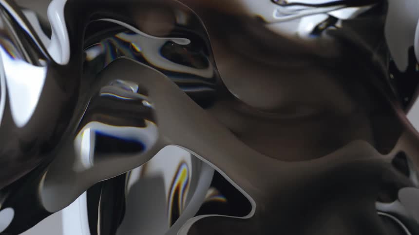 Metallic reflective surfaces of a brown and white mixture flow through moving mass