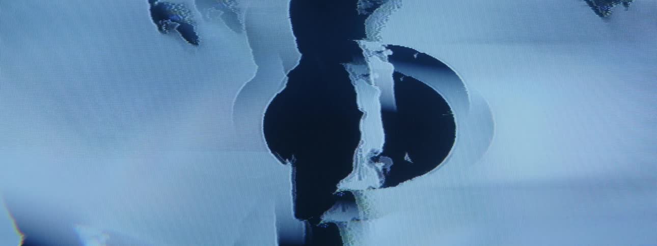 Distorted visual images flicker across a tv screen
