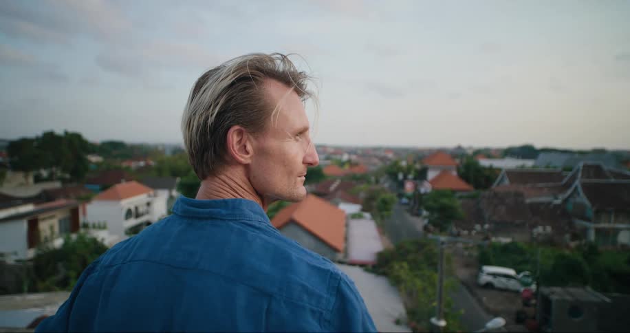 A man looks around a suburb