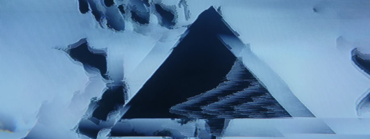 An abstract clip of a shaky screen displaying a pyramid