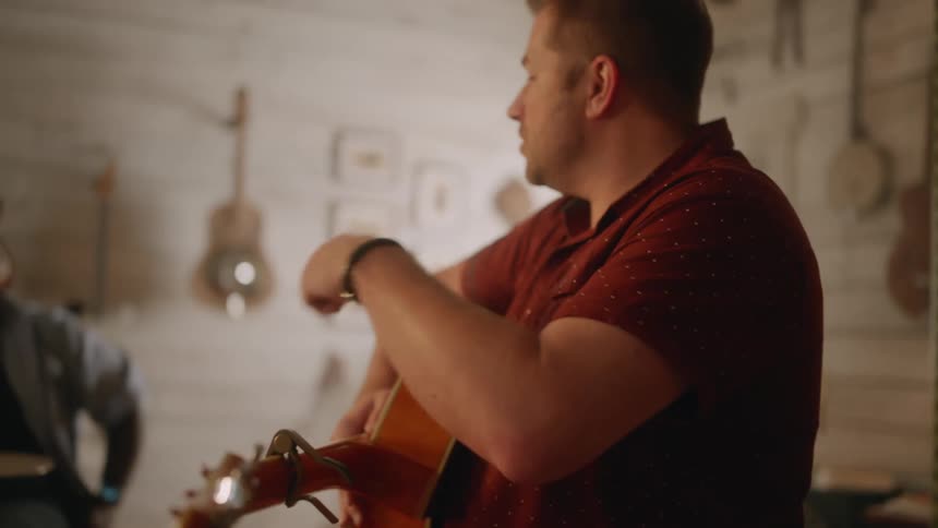 Musicians talk as they play instruments