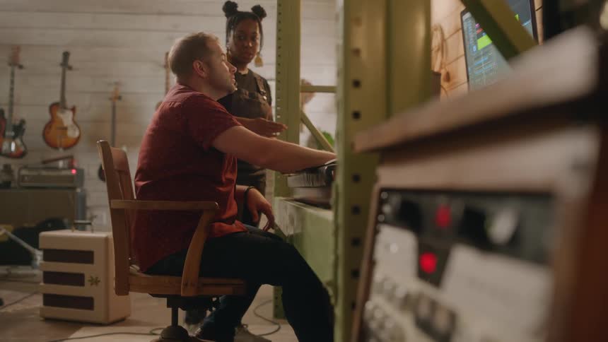 A clip of two people having a discussion in the studio
