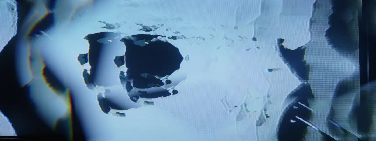 White and black massesflow over cluster of oval shapes