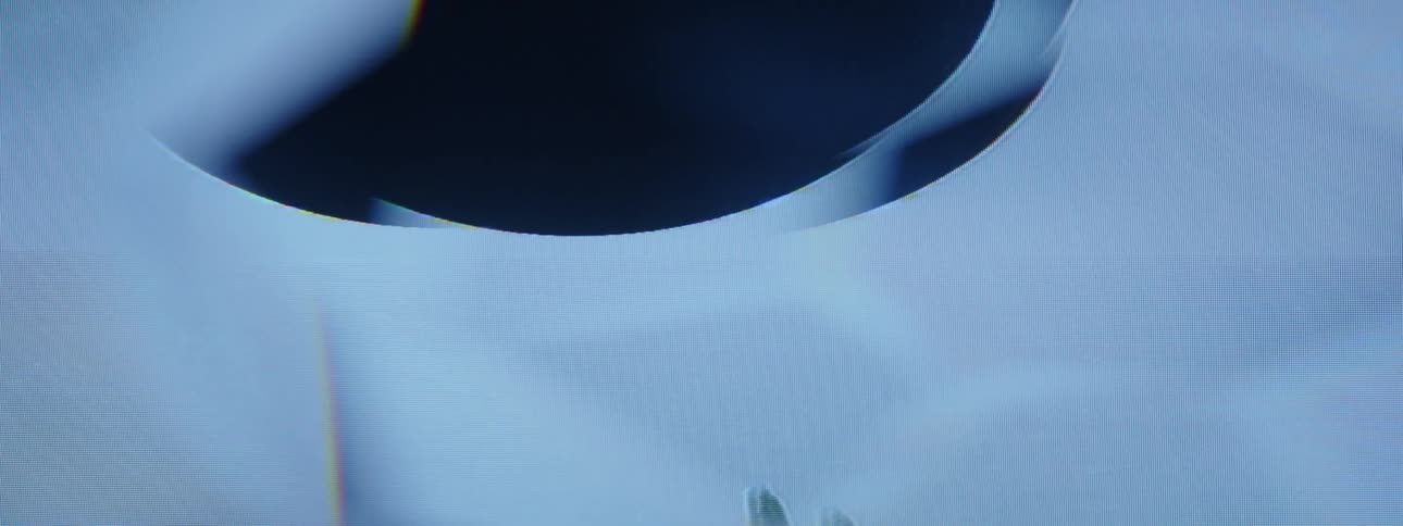 A television plays a graphic with distortions