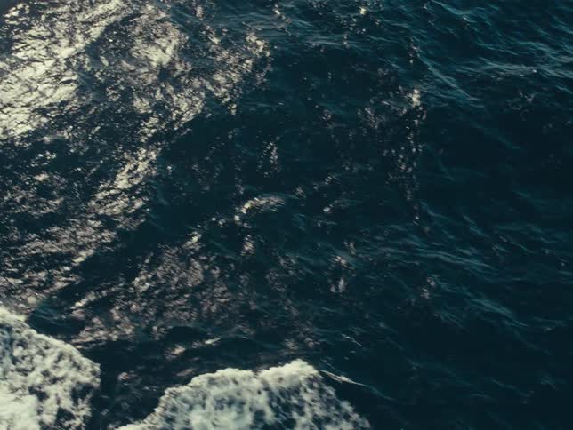 Big waves move across an ocean