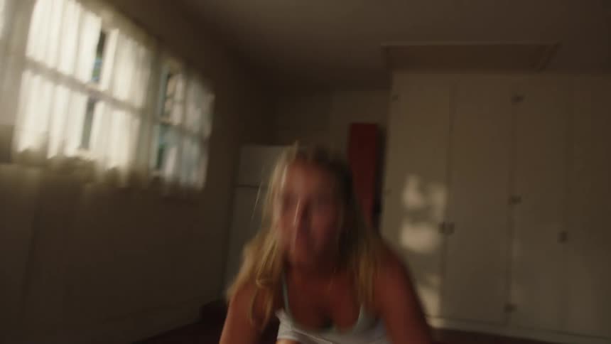 Tennis player works through exercise routine in gym