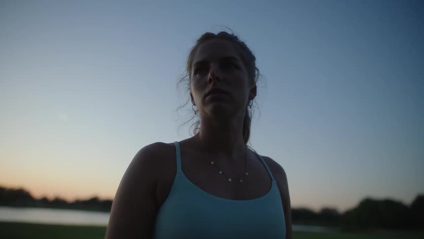 A woman looking around while out in nature