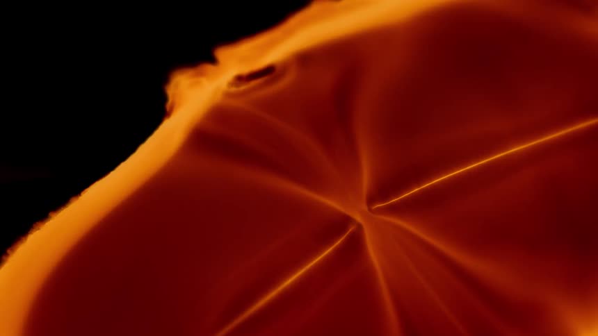 A movement of an abstract orange luminous object on a black background