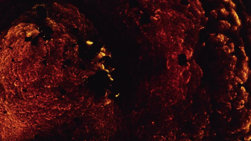 A smoking explosion with black and orange colors is expanding