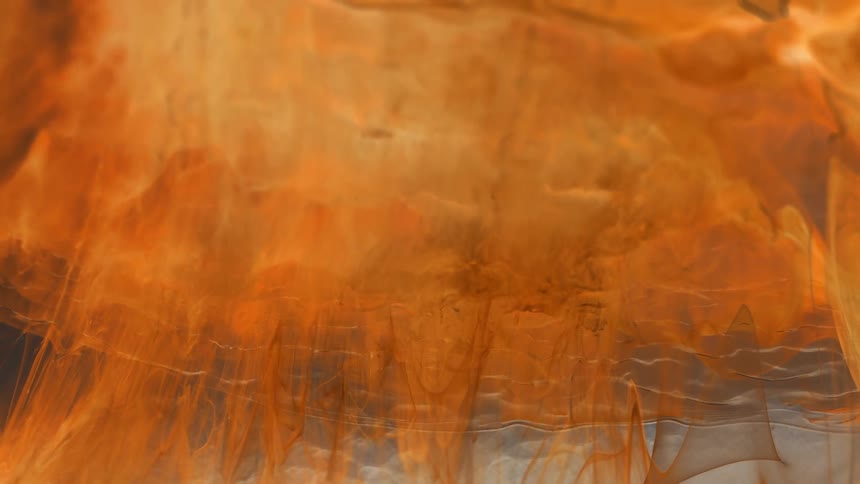 Orange paint falling into a transparent liquid
