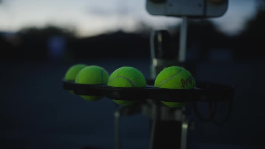 Tennis balls in a holder