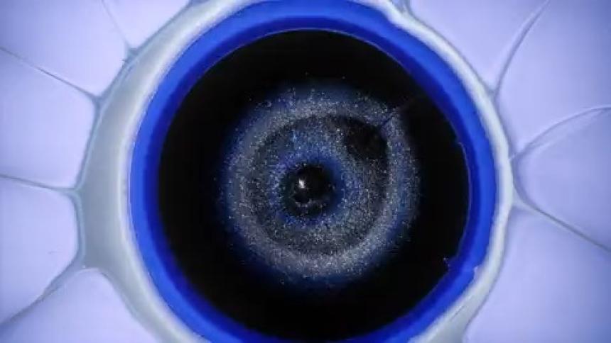 An effect of a colorful explosion revealing a dark void
