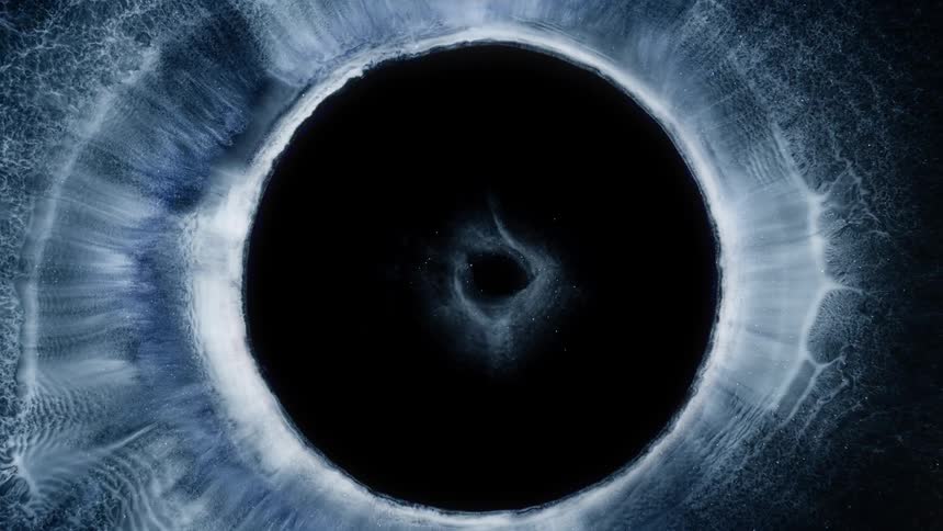 Dark center of mixture expands pushing white layers outward