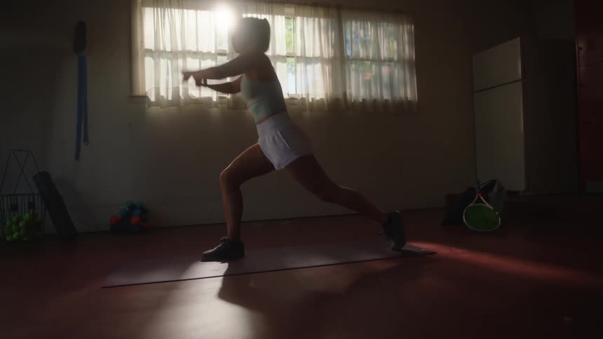 Woman on a mat stretching her body
