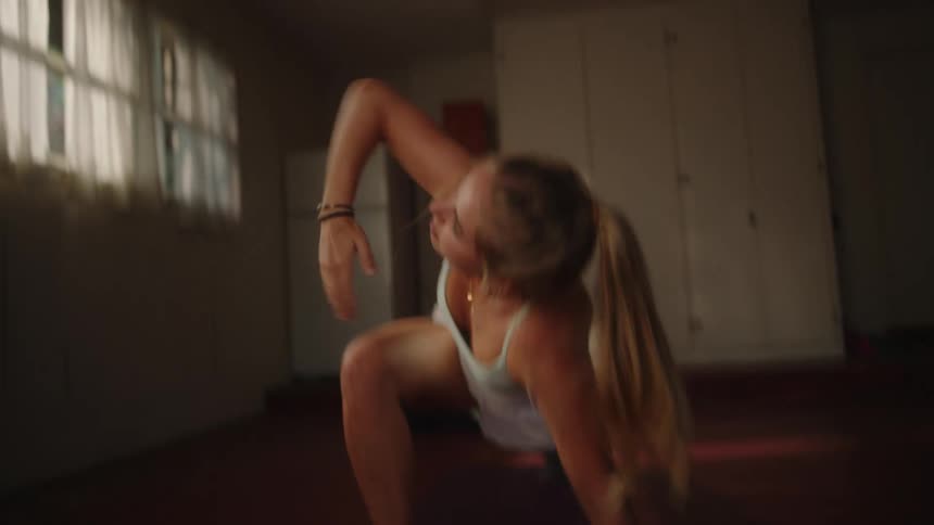 Woman indoors doing functional exercises