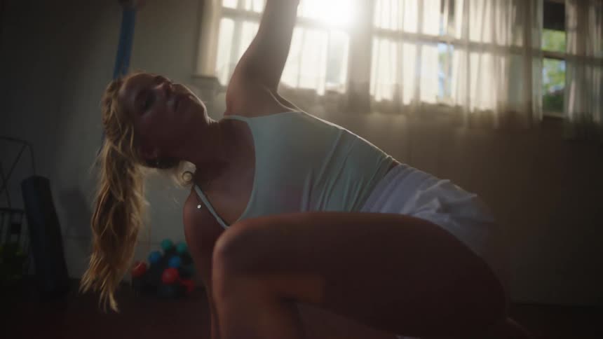 Woman indoors doing functional exercise