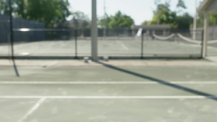 A tennis ball is hit on the court