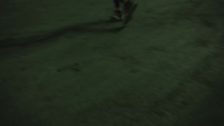 A woman runs back and forth on a tennis court