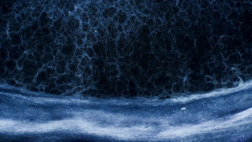 The image shows a closeup of a dark blue foamy substance with numerous bubbles floating down