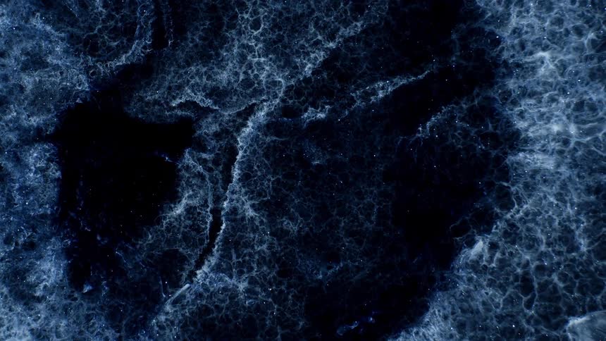 The white fluid spreads away in a circle