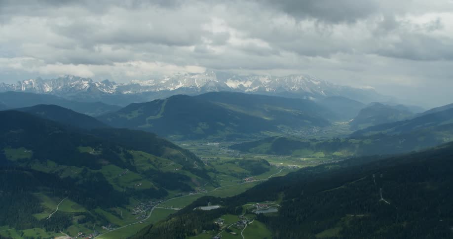 A lush valley between mountain ranges