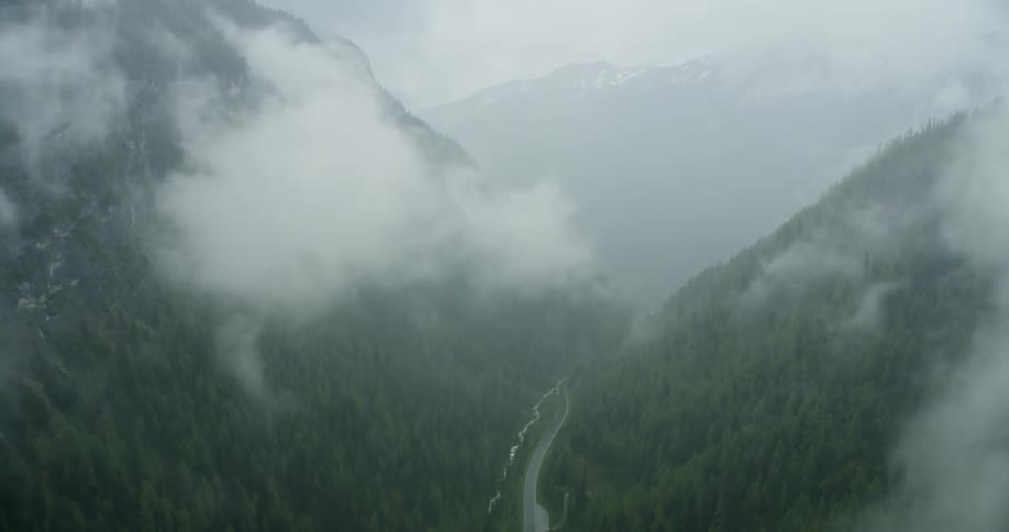 A road winds through a mountain valley