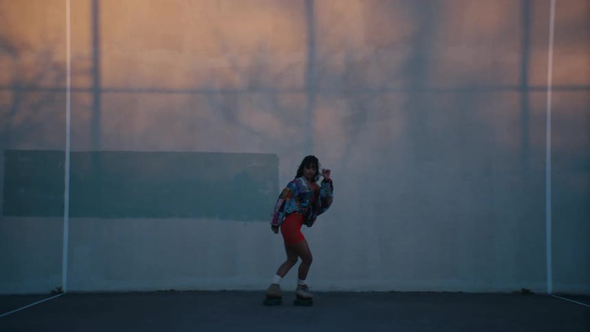 A young woman dancing on roller skates