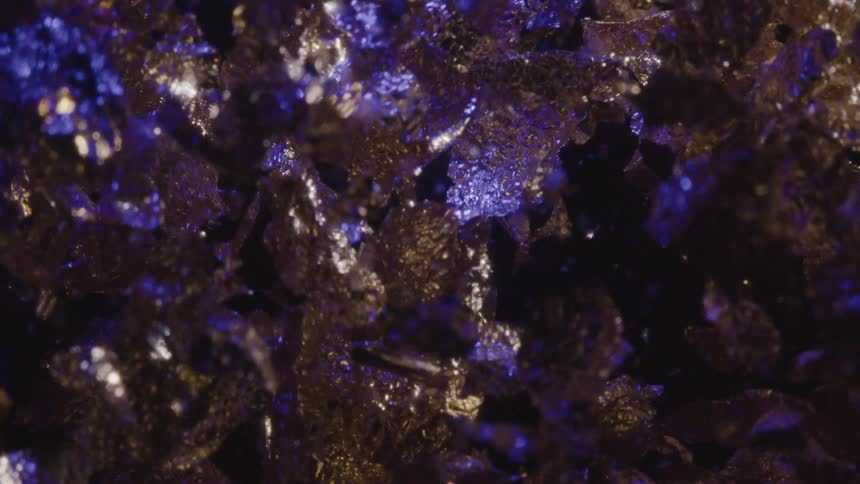 Extreme closeup on an intense glowing liquid in abstract motion