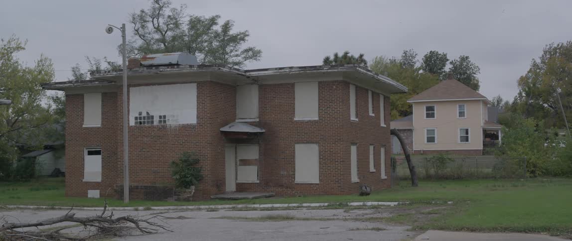 A building with boarded up windows