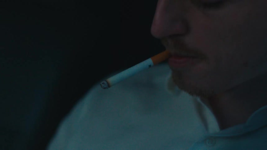 Man sitting smoking a cigarette