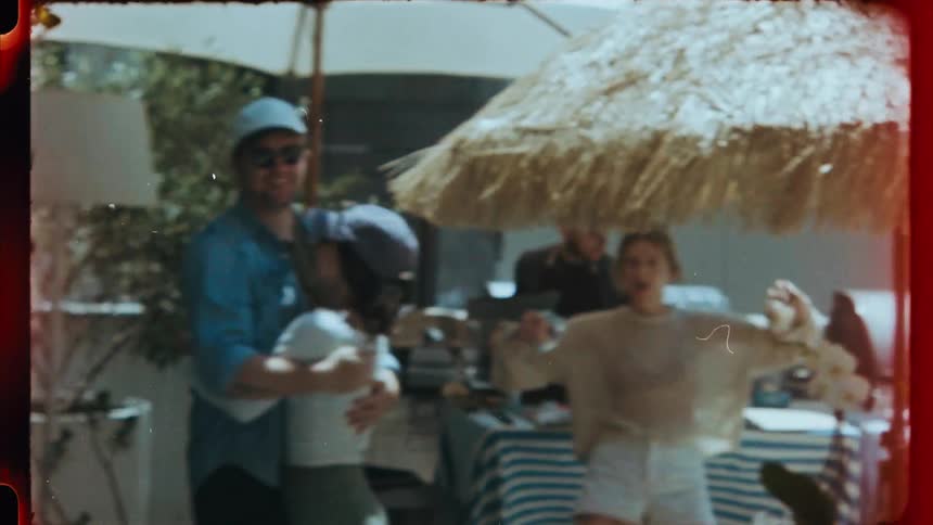 Vibrant friends dancing at a barbecue