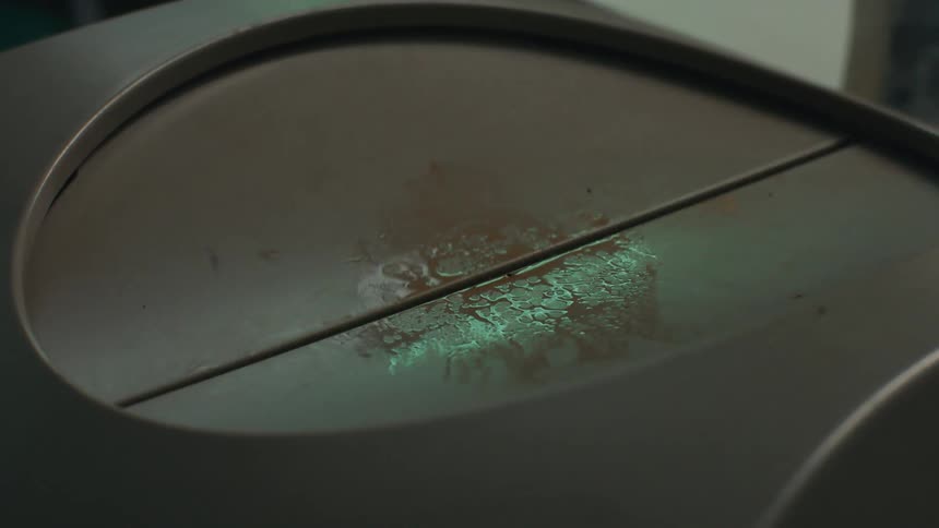 Trash is dropped into the garbage bin