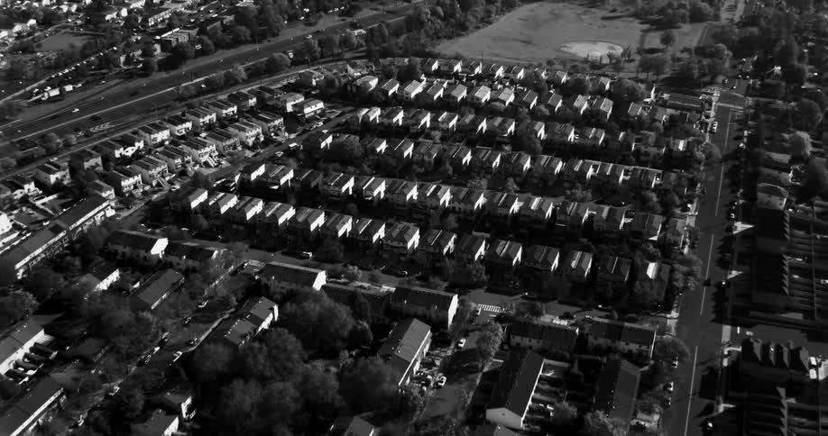 Traffic drives through the suburbs