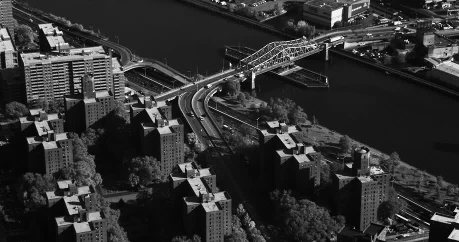 Aerial scene of a bridge that crosses a maritime channel and connects cities