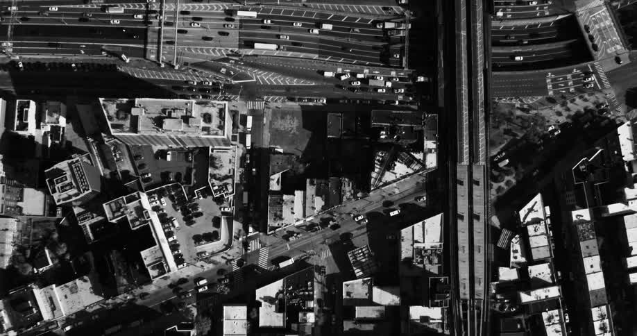 An aerial black and white view of an urban area