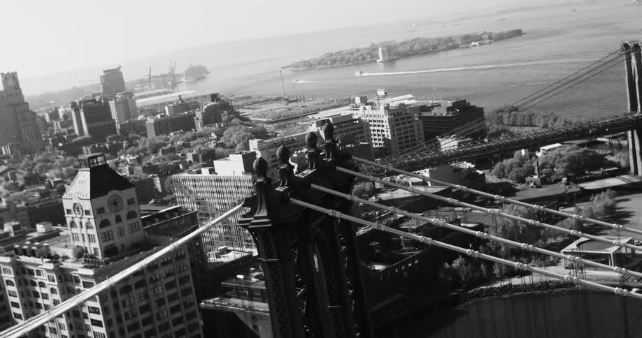 An aerial view of the brooklyn bridge and the new york city skyline