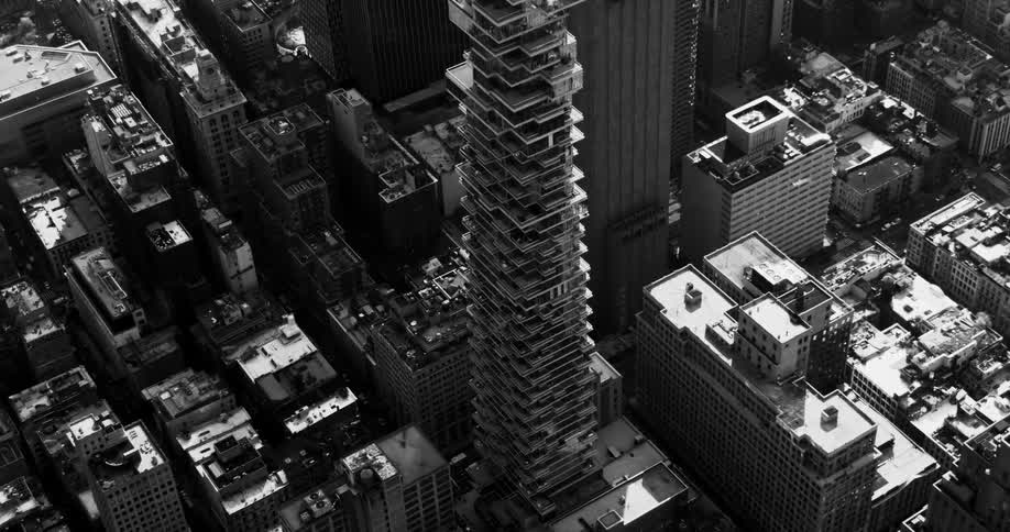 An oddly designed tower in a city downtown